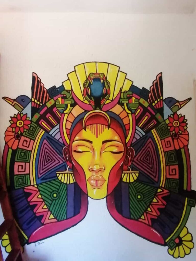 A mural of a woman with an indigenous looking headress.