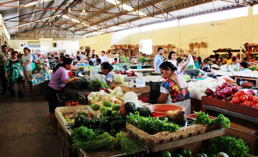 People buying vegetables at the Mercado in Valladolid Yucatan.