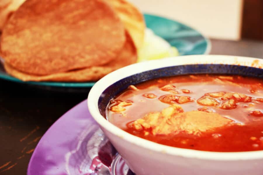 A close up of Pozole with tortillas at the food court in Valladolid.