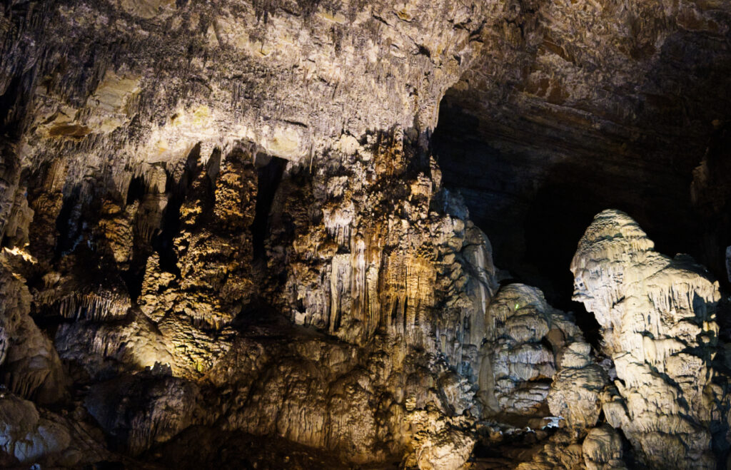 Inside the Grutas de Cacahuamilpa in Taxco, Guerrero are incredibly intricate stalactite and stalagmite formations. These are lit up with artificial lights installed within the Cacahuamilpa Caves.