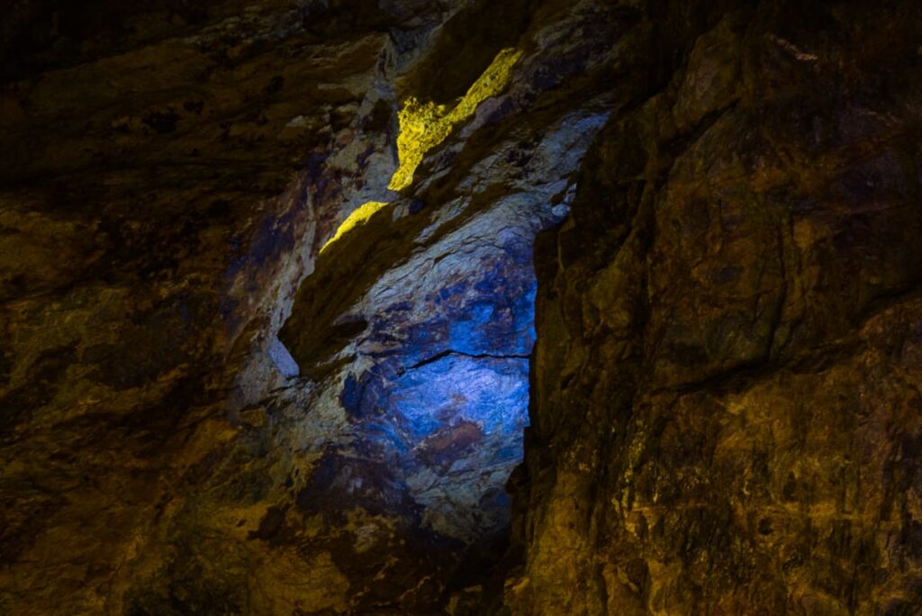 Light illuminates the rock, a source of silver and other precious metals inside Taxco's prehispanic silver mine.