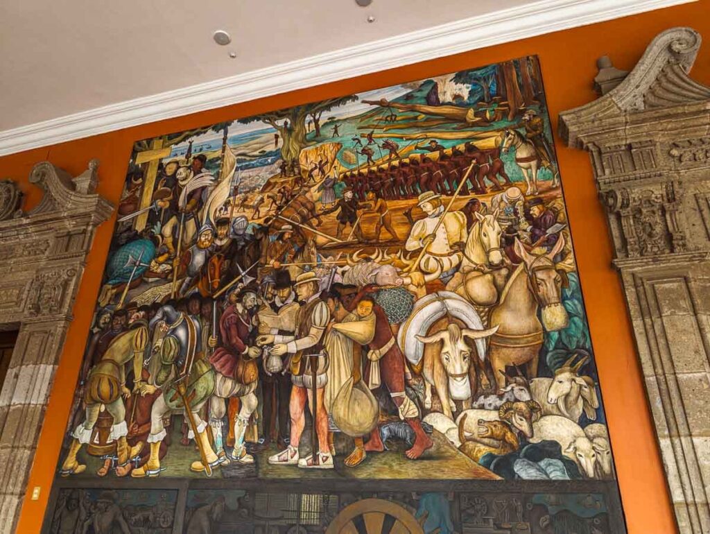 Diego Rivera's mural at the National Palace in Mexico City depicts people engaged in trade with dignitaries.