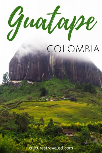 Foggy view of Guatape rock with text overlay "Guatape Colombia"