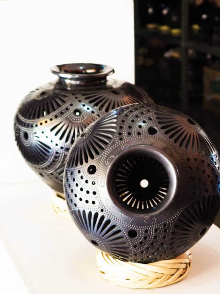 Shiny finished pieces of black pottery sit on display at one of the black pottery workshops in San Bartolo Coyotepec.