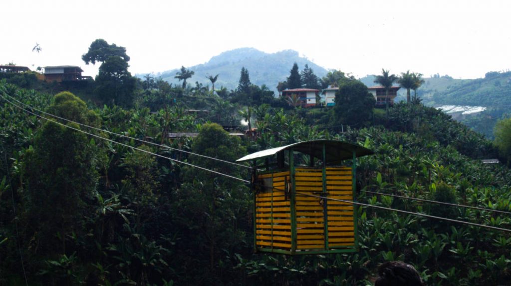 The yellow wooden slate cable car transporting passengers between the town and the mountain.