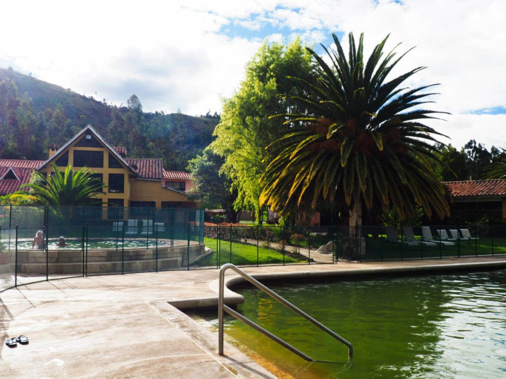 A rectangular thermal bath and a small circular bath in front of the El Batan Lodge.