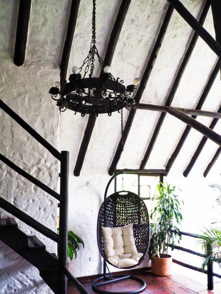 Wood beams adorn the ceiling in the seating area in the lodge at El Batan hot springs.