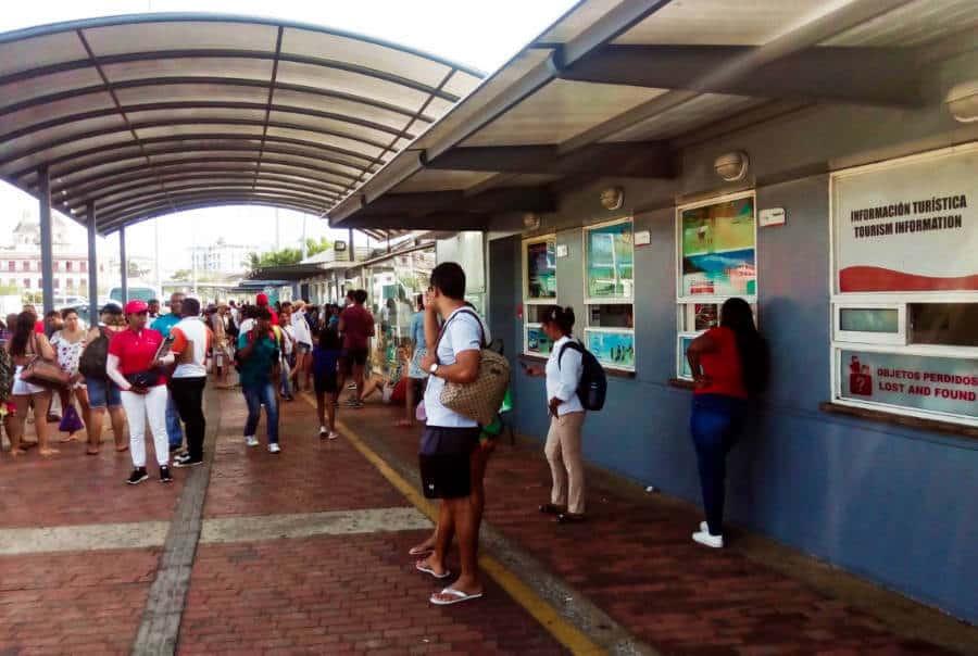People gather in front of the ticket windows at the Cartagena docks to take a tour or boat to the Rosario Islands.