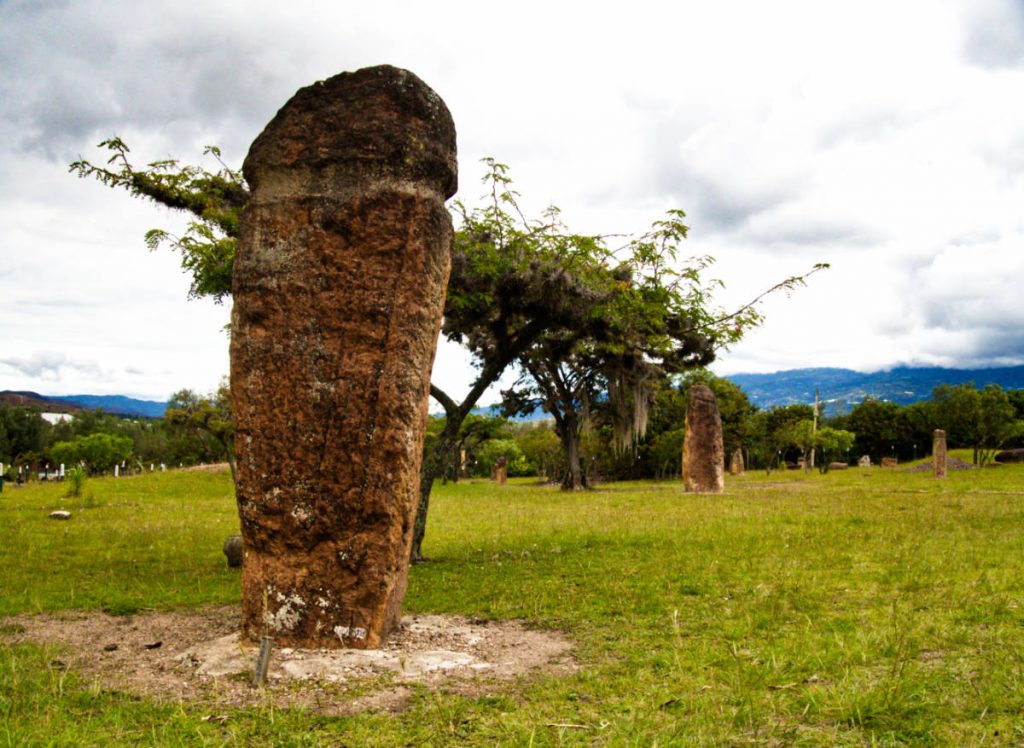 A stone column with an incised ring rises from the ground at El Infiernito, the archaeological site outside of Villa de Leyva.